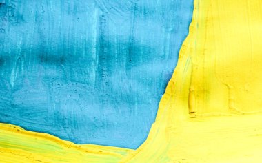 Sarı ve mavi renklerle çizilmiş soyut renk arkaplanı