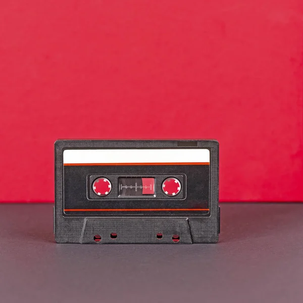 Zwarte retro audio cassette met gestreepte papieren label — Stockfoto