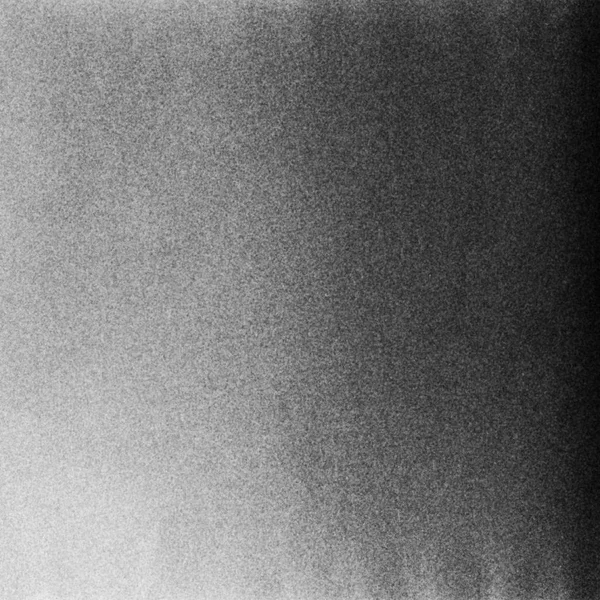 Чорно-білий текстурований фон зі світловими витоками і зерном . — стокове фото