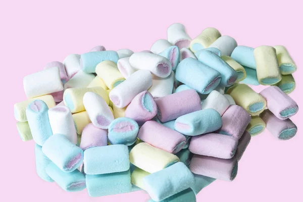 colored Marshmallow with mirror and light pink color background.