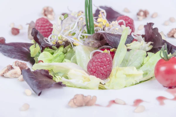 sprout beans salad, fresh lettuce, raspberry and cherry tomatoes