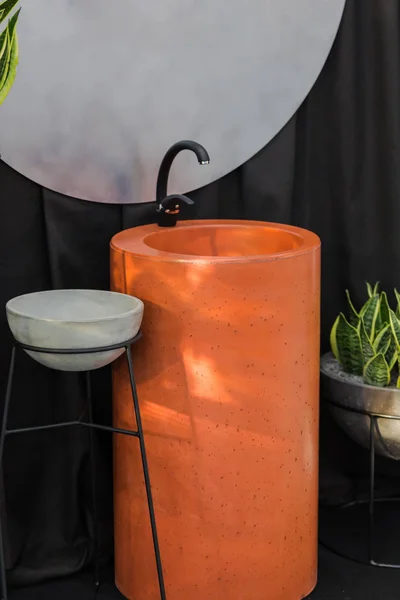 Barrel-shaped concrete sink, orange cement sink, black faucet, original bathroom