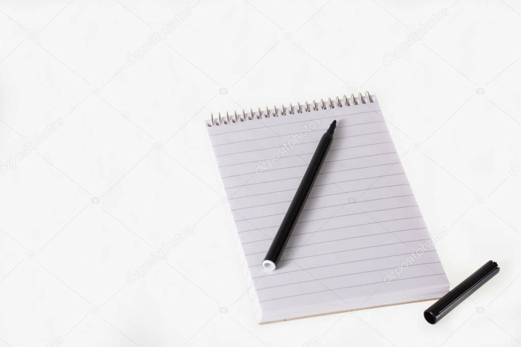 Notepad and pen on white background. Business, finance, school concept. Business, finance, school backgrounds.