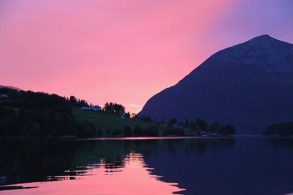 Amazing picture of sunset on the fjord in Norway.Gogreous nature landscape backgrounds. Beautiful Summer in Norway. Europe.