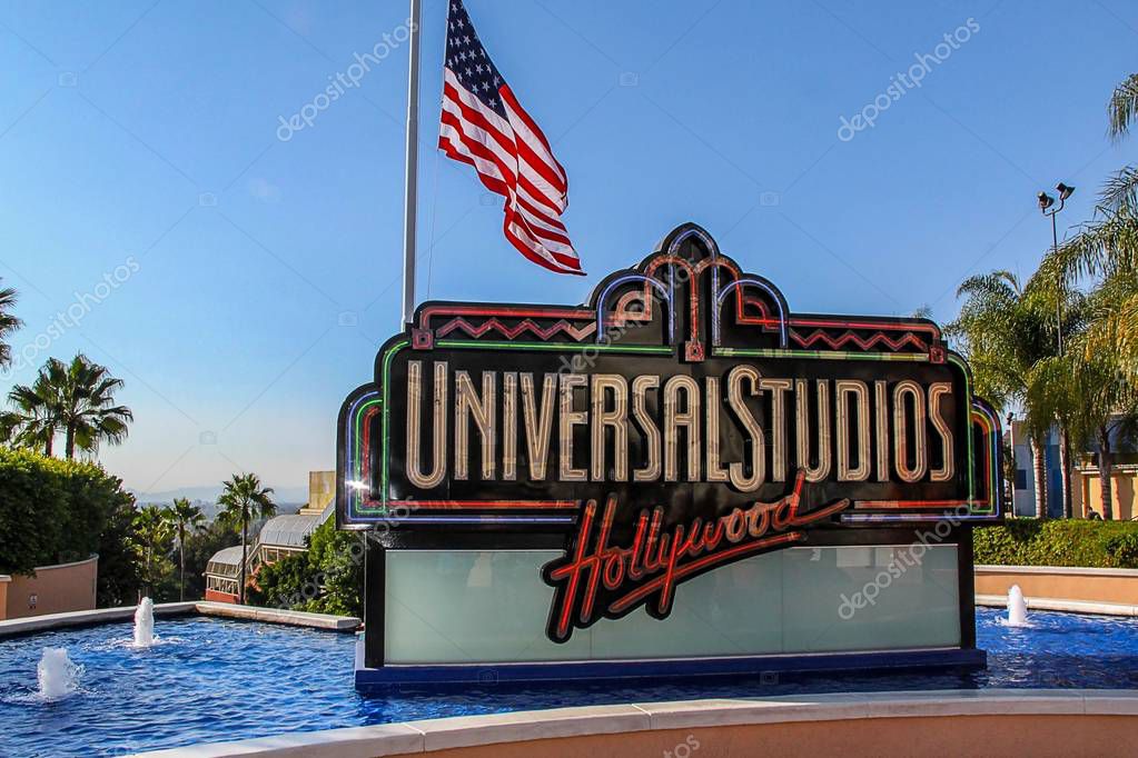 Close up view of Universal Studios logo surrounded of blue fountain water. Beautiful backgrounds. USA. Los Angeles. 09.12.2012