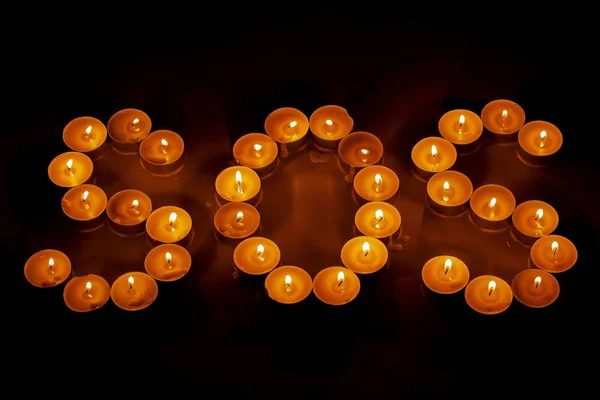 Close View Sos Sign Tealights Beautiful Backgrounds — Stock Photo, Image