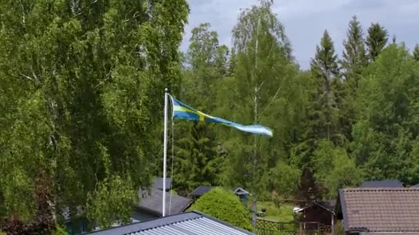 Beautiful View Swedish Flag Thhe Top Roof Green Trees Background — Stock Video