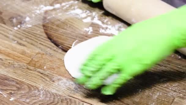 Close View Female Hands Green Gloves Making Dough Wooden Table — Stock Video