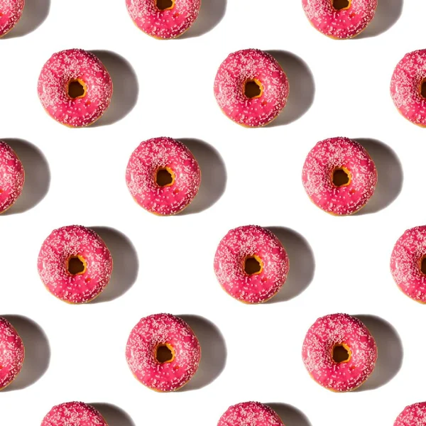 Close up view of pattern donuts sprinkled with glaze isolated on white background. Food and drink concept.