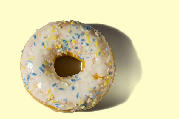 View Donut Sprinkled Multicolored Glaze Isolated Yellow Background Food Drink — Stock Photo, Image