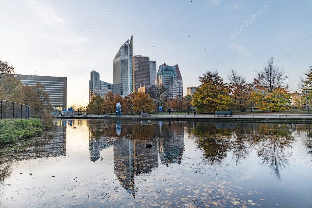 Sunrise on The Hague cityscape reflected on the water at the autumn season
