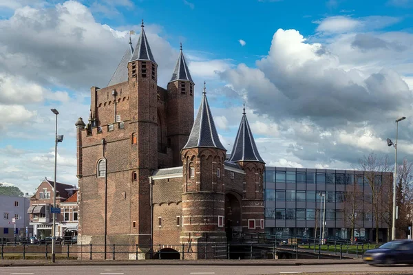 Medieval Haarlem city entry gate above the canal with its bridge and gate keeper towers