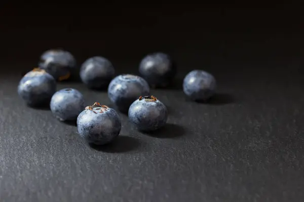 Group Nine Fresh Canadian Blueberries Lying Dark Stone Table Everything — Stock Photo, Image
