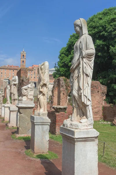 Roman statues at House of the Vestals in Forum Romanum. Rome. Italy. Vertically.