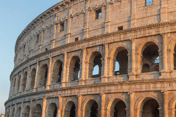 The arcs of Colosseum in sunset light. Rome Italy. Horizontally