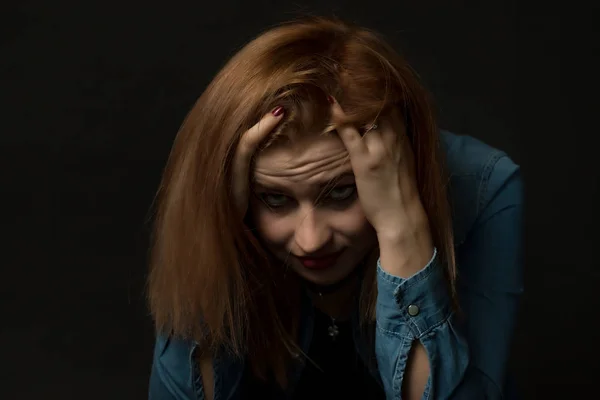 Low key portrait of depressed young woman — Stock Photo, Image