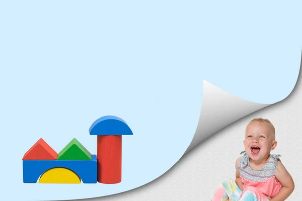 Building game concept with laughing toddler girl — Stock Photo, Image