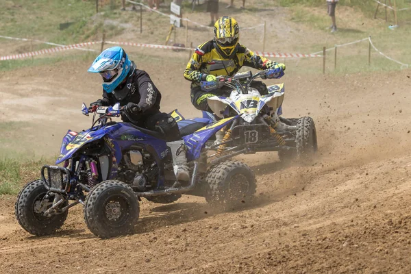 Pair of quad riders passing turn — Stock Photo, Image