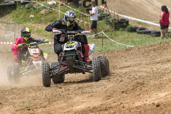Rider in black on a quad bike is a passing turn — Stock Photo, Image