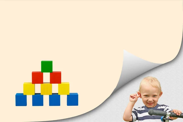 Smiling Blond Boy Bent Corner Page Colorful Pyramid Wooden Cubes — Stock Photo, Image