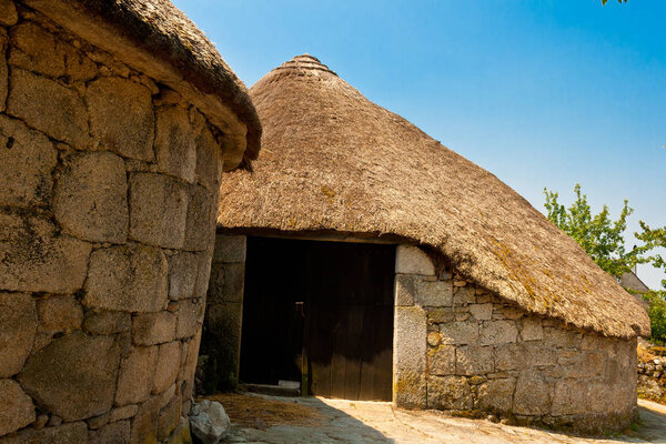 Palloza: traditional rustic construction of Celtic origin. Stone base, round or elliptical plant and straw cover. Used as house or barn. Pre-Roman village of Piornedo, Os Ancares, Lugo, Galicia, Spain