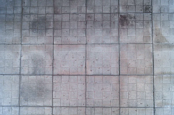 Eine Wand Aus Alten Quadratischen Grauen Platten Mit Geometrischem Muster — Stockfoto