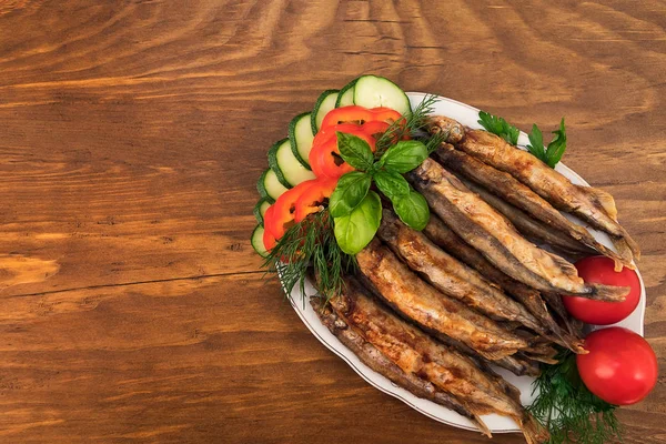 Capelin Tamamen Altın Kahverengi Oluncaya Kadar Yağda Kızartılmış Bir Garnitür — Stok fotoğraf