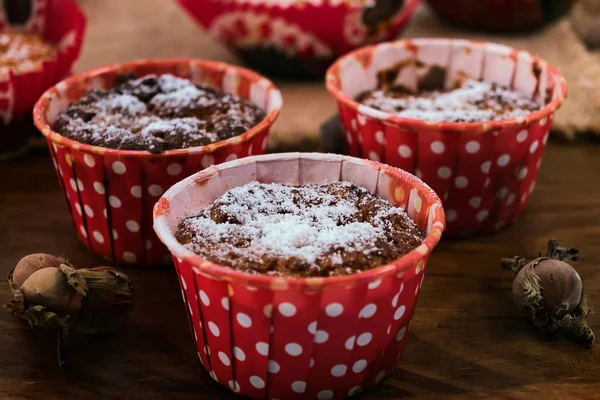 Low-calorie cookies made of oat flakes with cottage cheese along with nuts on a wooden background.