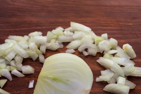 Cut Half Bulb Surrounded Chopped Onions Wooden Background Close — Stock Photo, Image