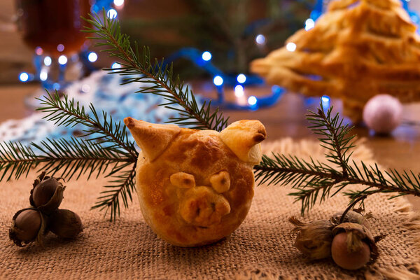 A collage of photos of the pig's head  the symbol of 2019 from puff pastry.