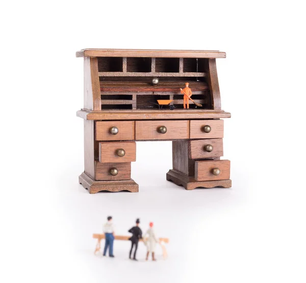 Small vintage wooden desk, small man cleaning - Clean desk policy