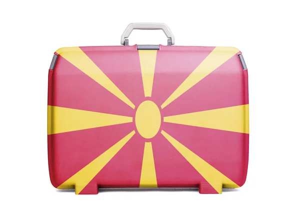 Used plastic suitcase with stains and scratches, printed with flag, Macedonia