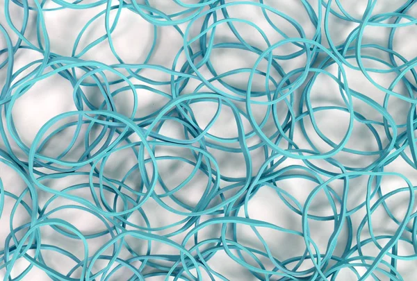 Beyaz arkaplanda küçük lastik bantları kapat