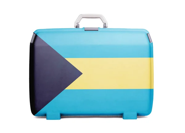Used plastic suitcase with stains and scratches, printed with flag, Bahamas