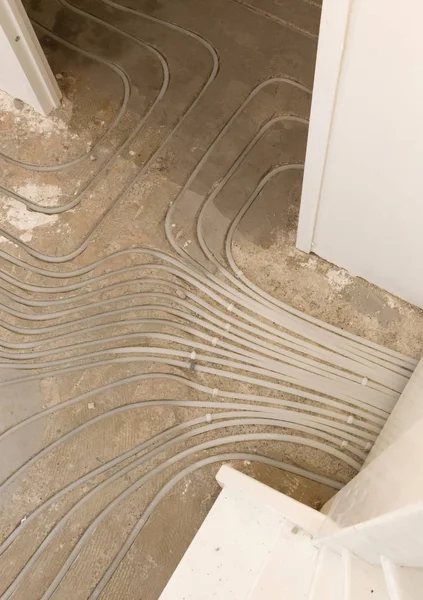 Water underfloor heating pipes in a concrete floor