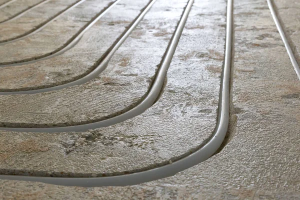 Water underfloor heating pipes in a concrete floor
