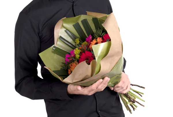 Människan Ger Blommor Isolerad Vitt — Stockfoto