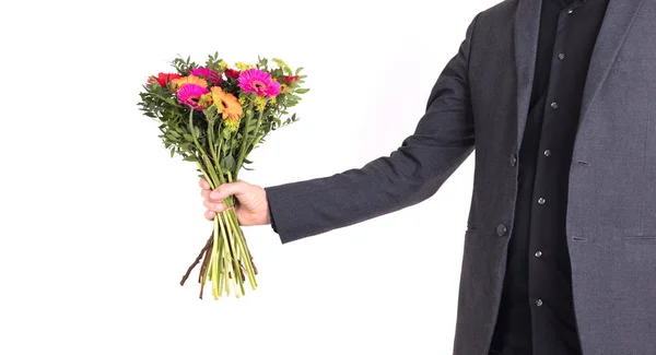 Homem Está Dando Flores Isolado Branco — Fotografia de Stock