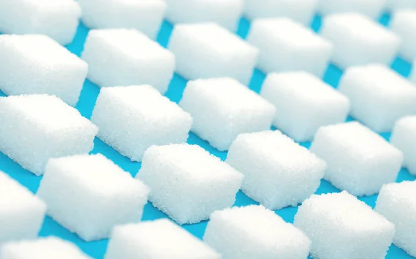 Białe Słodkie Kostki Cukru Płynny Wzór Niebieskie Tło — Zdjęcie stockowe