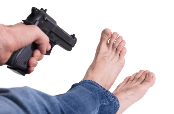 Man shooting himself in the foot — Stock Photo, Image