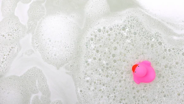 Pink duck in a bathtub — Stock Photo, Image