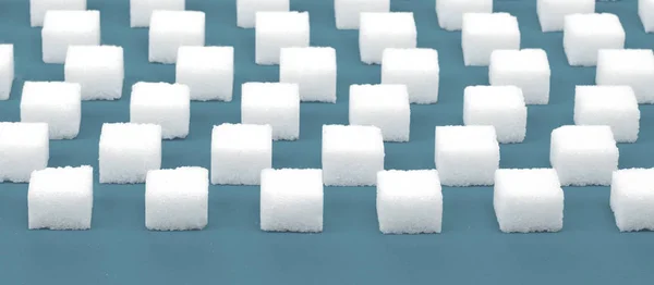 白砂糖キューブのシームレスなパターン 青の背景 — ストック写真