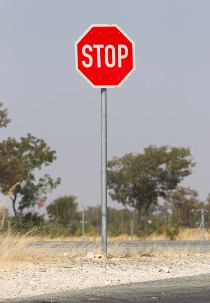 Stop sign at the side of the road, Namibia