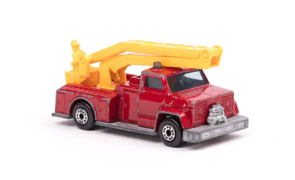 Speelgoedauto Met Ladder Gevouwen Witte Ondergrond — Stockfoto