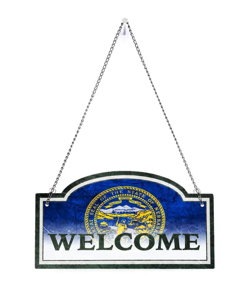Nebraska welcomes you! Old metal sign isolated — Stock Photo, Image