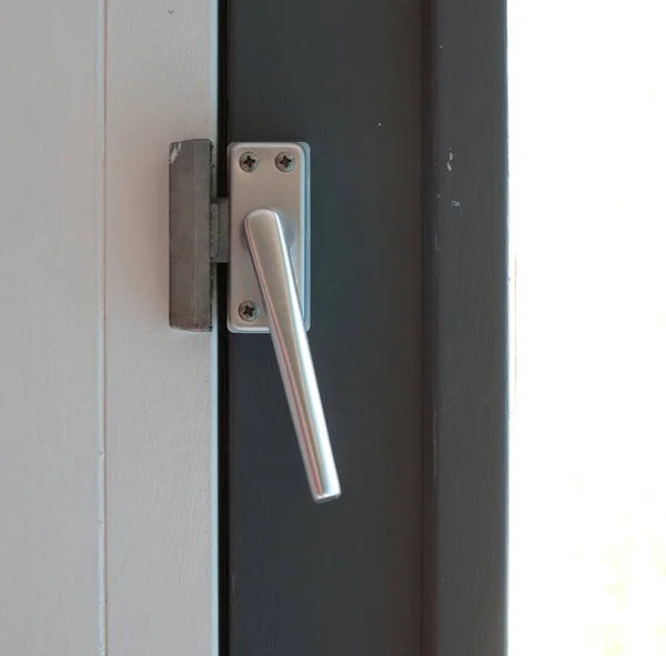 Close up view of aluminum door window handle — Stock Photo, Image