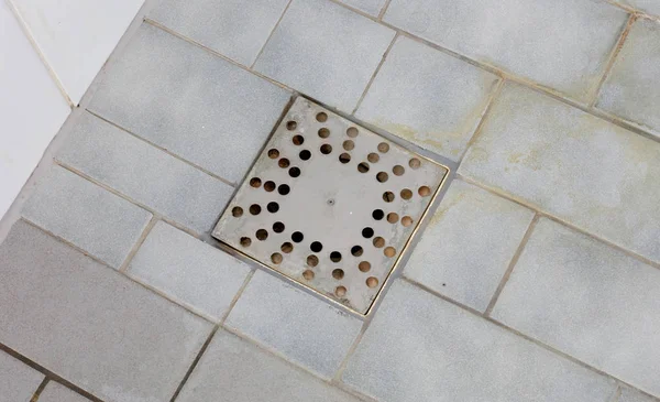 Floor drain in an old shower — Stock Photo, Image