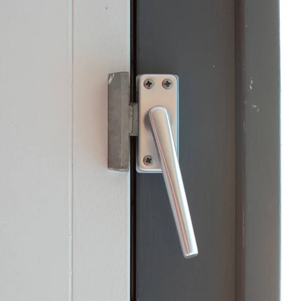 Close up view of aluminum door window handle — Stock Photo, Image