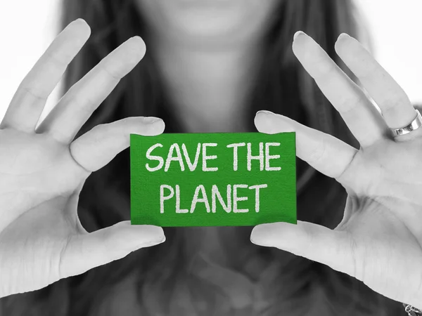 Vrouw die een bericht toont: Red de planeet — Stockfoto