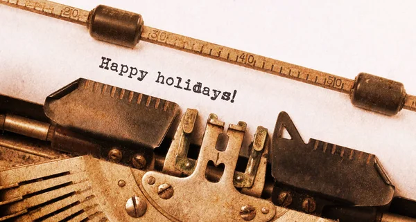 Happy holidays, written on an old typewriter — Stock Photo, Image